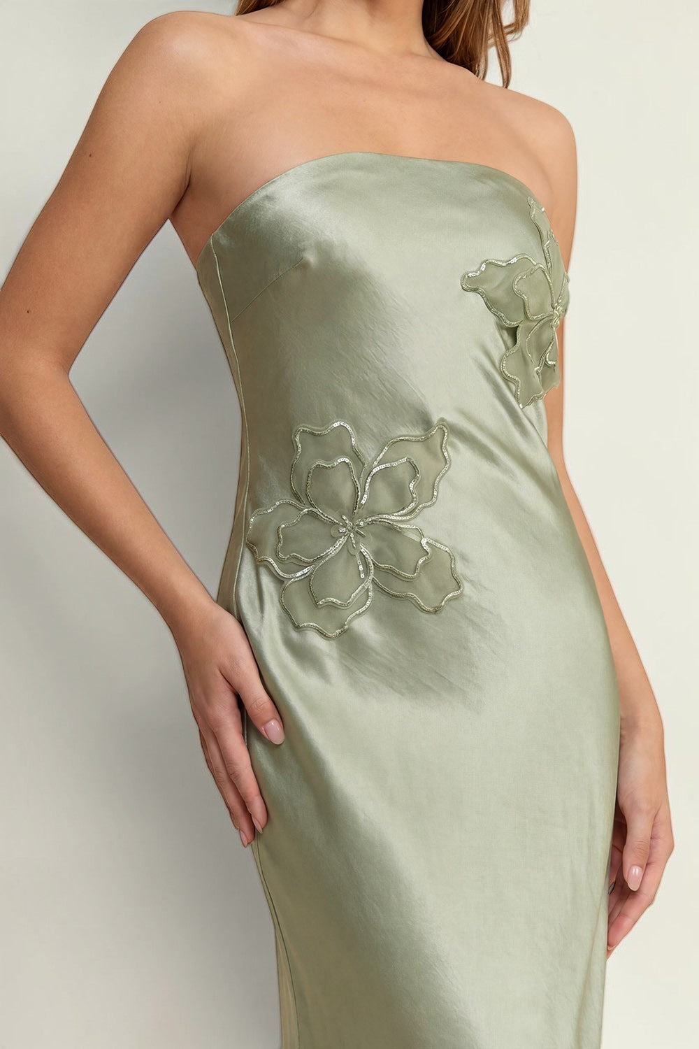 Blackandbone sage green strapless maxi dress with floral appliques on bodice, made of satin-like fabric.